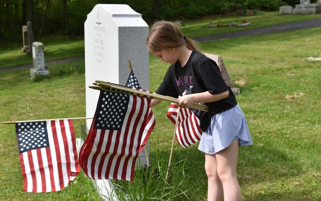 Students place flags on Blandford graves, hear from veteran