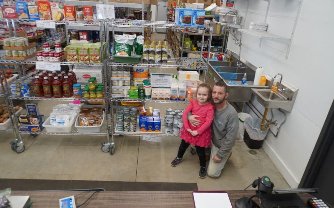 Local business adopts a shelf at Our Community Food Pantry