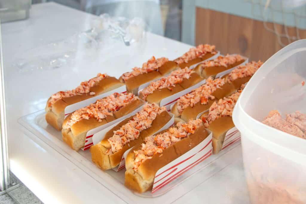 Lobster rolls sitting in a display case at the Big E